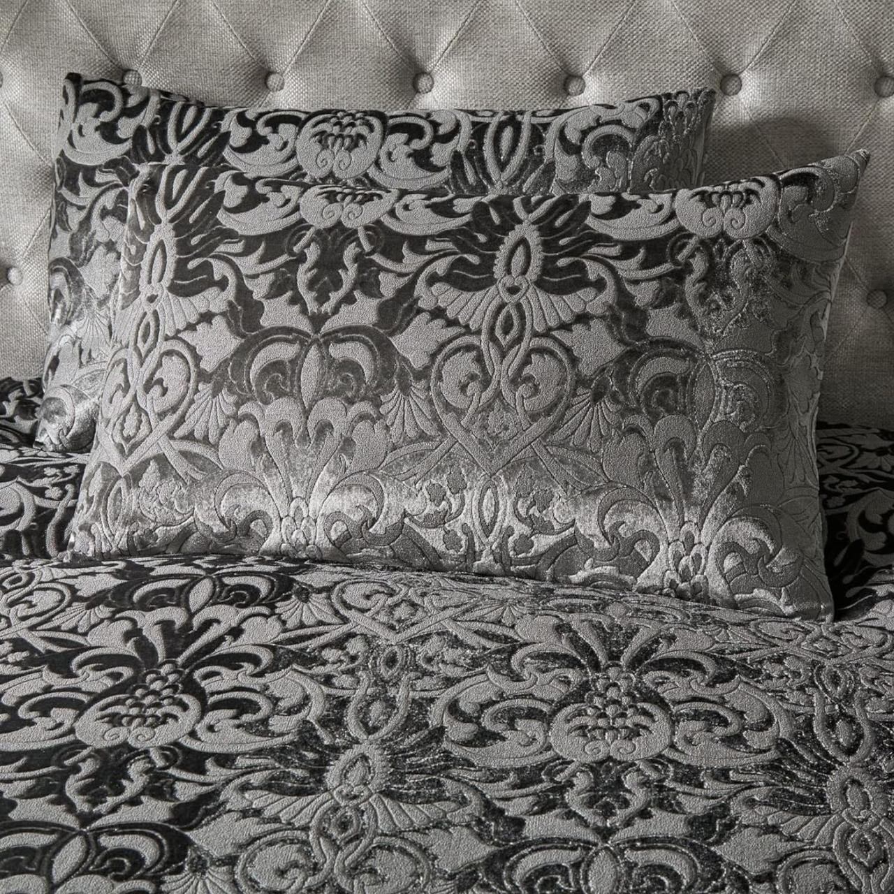 Jacquard Embossed pillowcase — damask pattern close-up on tufted headboard